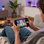 Engaging gaming moment with dk7 สล็อต on mobile device in a cozy home environment, showcasing the enjoyment of playing online slot games.