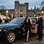 Nottingham Limo Hire featuring a couple arriving in a Rolls-Royce Phantom with a professional chauffeur at a scenic Nottingham landmark